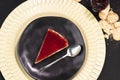 Red fruits Cheesecake frutas on a black plate Royalty Free Stock Photo