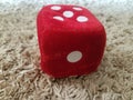 Red furry dice for children playing Royalty Free Stock Photo