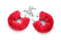 Red furry handcuffs on white background, top view. Accessory for sexual roleplay Royalty Free Stock Photo