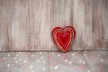 Red Fuzzy Handmade Heart on Vintage Wood Background