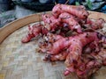 Red galangal is placed on a bamboo tray Royalty Free Stock Photo