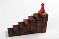 Red game piece on top of pyramid. Career promotion Royalty Free Stock Photo