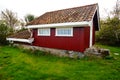Red garden house near fjord Kragero, Portor