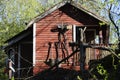 Red garden wooden shed and tools Royalty Free Stock Photo