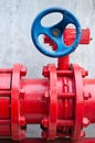 Red gas pipe with blue valve