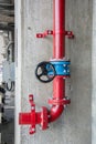 Red gas pipe with blue valve