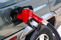 Red gasoline pump nozzle Royalty Free Stock Photo