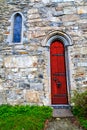 The red gate to the stone church, Norway Royalty Free Stock Photo