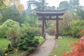 Red gates to wooden bridge inside japanese garden in Lebverkusen - amazing scene in garden in Germany -autumn