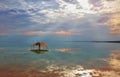 Red gazebo in the water near the shore Royalty Free Stock Photo