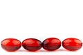 Red gel medical capsules, isolated on white background Royalty Free Stock Photo