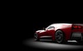 Red generic sport car on a dark background Royalty Free Stock Photo