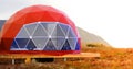 Red geo-dome tent on Kamchatka peninsula. Cozy, camping, glamping, holiday, vacation lifestyle concept. Outdoors cabin