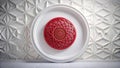 Red geometric mandala in an ornate white frame against a textured white wall. Generative AI Royalty Free Stock Photo