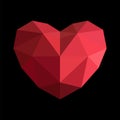 Red geometric origami heart on the black background