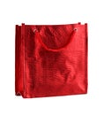 Red gift bag isolated on the white background. It is a small bag with an embossed pattern. It is intended for shopping or for Royalty Free Stock Photo
