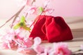 Red Gift Bag and plum blossom on Old Shabby Wooden Table concept Christmas and Newyear. Royalty Free Stock Photo