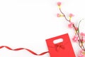 Red gift bag and ribbon decorated with fake pink flowe Royalty Free Stock Photo