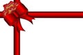 Red gift bow with ribbons for greeting design. Royalty Free Stock Photo