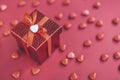red gift box on the background of hearts for Valentine's Day Royalty Free Stock Photo