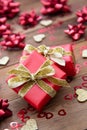 Red gift box with bows, on wooden background. Copy space. Valentine's day, birthday, Christmas Royalty Free Stock Photo