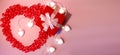 Red gift box , bright white heart-shaped garlands on a pink background. Banner Royalty Free Stock Photo