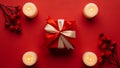 Red Gift Box with Candles and Berries Royalty Free Stock Photo