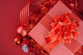 Red Gift box with decorations and color ball on red background Royalty Free Stock Photo