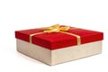 Red gift box with gold ribbon bow, isolated on white Royalty Free Stock Photo