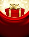 Red gift box with golden bow Royalty Free Stock Photo