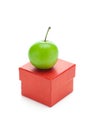 Red gift box and green plum Royalty Free Stock Photo