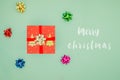 Red gift box with GREEN ribbon. Christmas present card