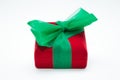 Red gift box with green ribbon  on a white background Royalty Free Stock Photo