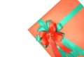 Red gift box with green ribbon on a white background