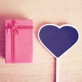 Red gift box and heart shaped blackboard with copy space Royalty Free Stock Photo