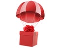 Red gift box with parachute flying on white background