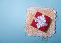 red gift box on pastel blue background. Top view of various present boxes. Royalty Free Stock Photo