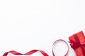 Red gift box and red ribbon isolated on white background. Christmas and New year concept. Mock up, copy space. winter holidays Royalty Free Stock Photo