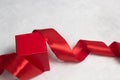 Red gift box with red satin ribbon Royalty Free Stock Photo