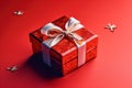 Red gift box with ribbon and bow isolated on red background.Holiday gift with Birthday, Christmas present, flat lay, top view, Royalty Free Stock Photo