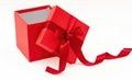 Red gift box with ribbon and bow open isolated on white background Royalty Free Stock Photo