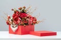 Red gift box of rich rose flowers with heart