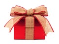 Red gift box with rustic burlap bow and ribbon Royalty Free Stock Photo