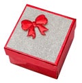 Red gift box with shinny silver cover and red bow, close up, isolated. Royalty Free Stock Photo