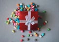 Red gift box on colorful corn chips