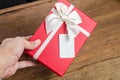 red gift box with tag
