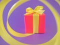 Red Gift box at the end of the spiral yellow ribbon, purple background. Royalty Free Stock Photo