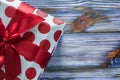 Red gift box on vintage wooden board front view Royalty Free Stock Photo