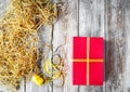 Red gift box on wooden background with ribbons Royalty Free Stock Photo
