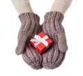 Red gift box in wool gloves